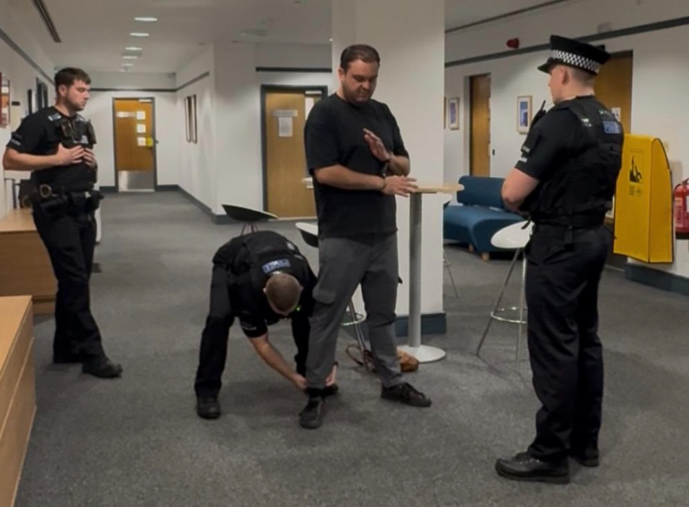 A photo of Reform councillor Sam Journet getting arrested